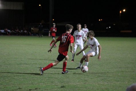 Landon Clark running the ball down the field.