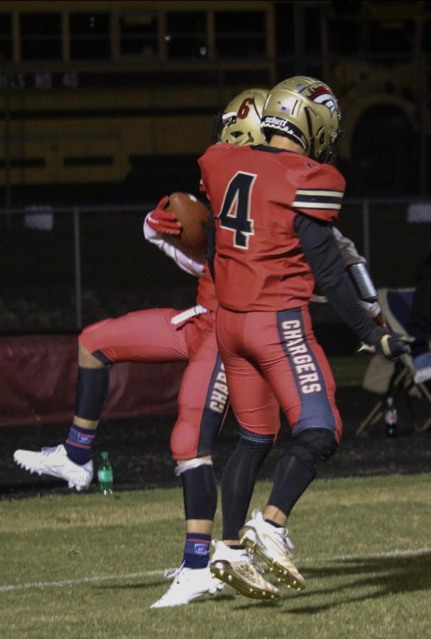 Senior Receiver Daniel Gilbert jumping and bumping his teammate. Gilbert scored two touchdowns out of the four touchdowns scored by Bullitt East. “It was a great feeling (scoring two out of the four touchdowns); not just for me, but to see my other brothers, and receivers, scoring and catching footballs, is just as great,” said Gilbert.