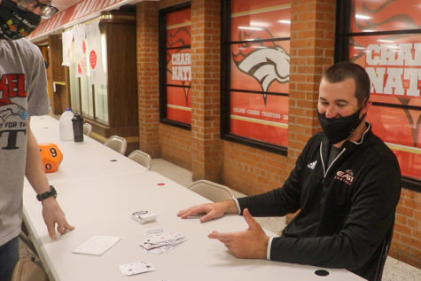 Head Football Coach Ethan Atchley having a face of confusion. Apr. 29, Atchley watched a magic trick, and was quite fooled. “Well, I mean, obviously, you had me. Really shuffled the deck up, and put them with the note. You flipped them over, and obviously, you had cards go in different directions. So, I was a little confused at that, at first, but I see why, and ultimately, you had every four or five of your predictions were all correct. So, it was definitely unique,” Atchley said.