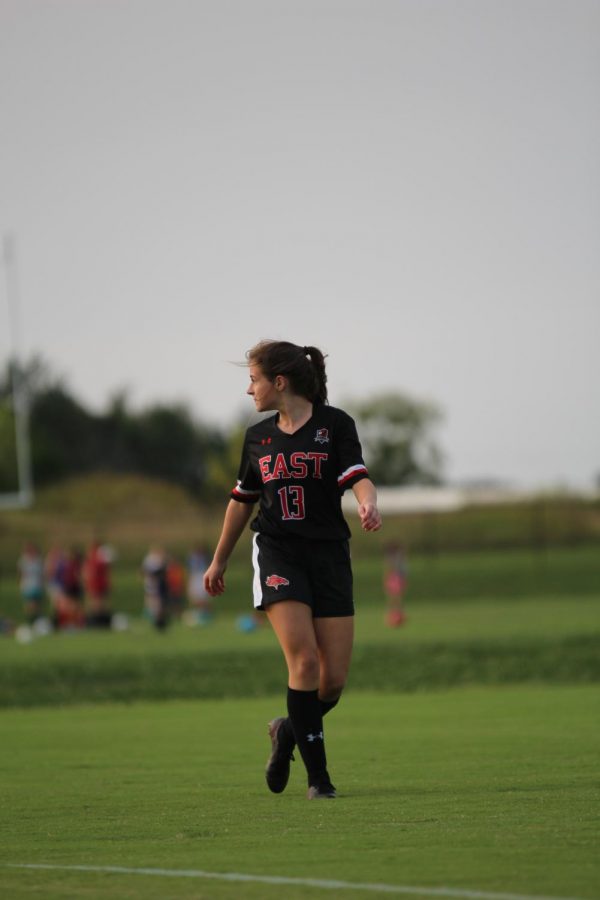 Senior Emma Wright watching her back as the ball is reset. "I was glad to have scored against Atherton because it was a good opportunity to lead my team after being gone and show them that I'll give them everything I've got," said Wright.
