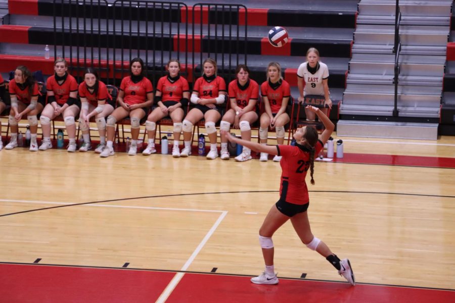 Emma Brogan, Junior, goes to serve the ball over the net during the girls volleyball game against North Hardin. Bullitt East ended up winning against North Hardin.