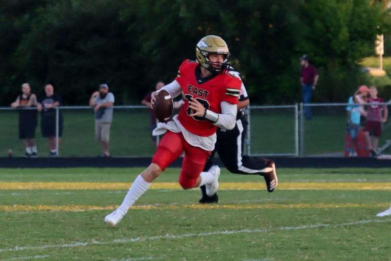 Junior Travis Egan running a play during the Bullitt Cup. Sept. 17, Bullitt East faced Bullitt Central for the Bullitt Cup, and came out with a win, 76-39. ¨ I don't know that you could really say that it's a rivalry at this point, I believe for the past couple of years it's been a substantial win for us here at Bullitt East,¨ said linebacker coach Tolliver Hefner.