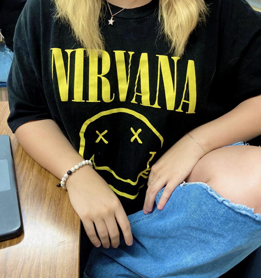 Junior+Chloe+Radford+poses+with+Nirvana+shirt.+She+has+been+a+fan+of+the+band+since+2016.+