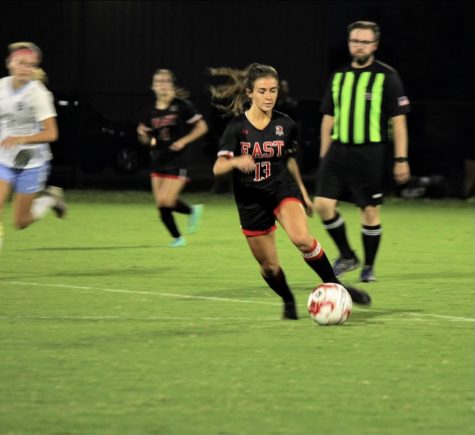 Senior Emma Wright dribbling the advancing the ball at thri last game against Mercy, Sept 27. Photo taken by Vicci Miles.