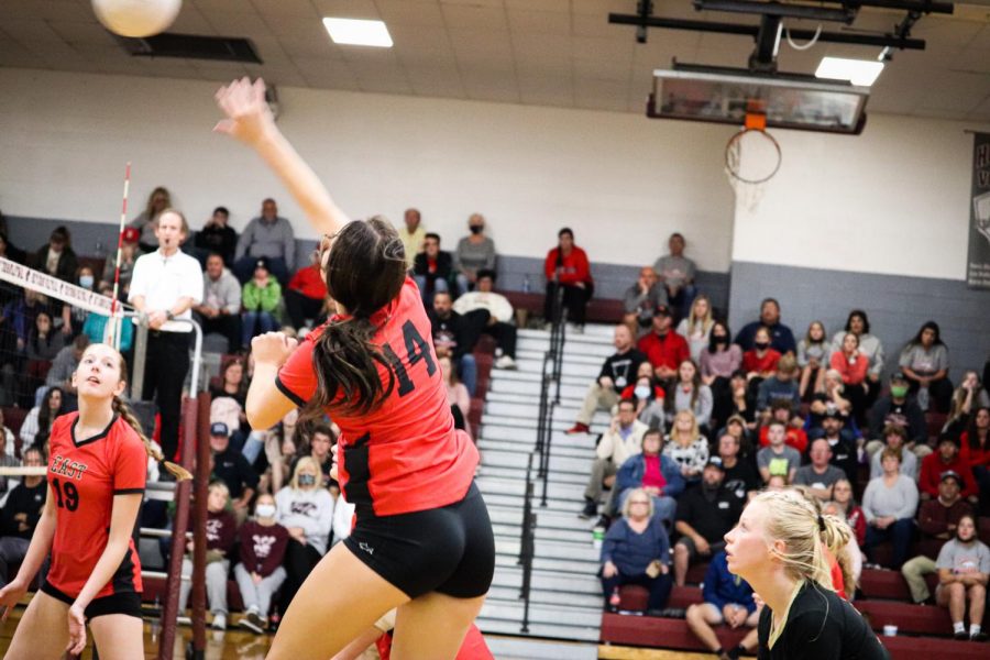 Junior Hayla Puckett attacks the ball after Holy Cross puts the ball back over the net. Nothing is better than the feeling of turning back around after just getting a kill and seeing the excitement in your teammates and coaches. Its the feeling that makes me keep playing even through the hardest times, Puckett said.  