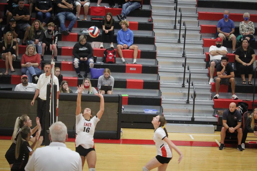 Senior Emily Huntsman sets up sophomore Kate Cissell to attack the ball in the game against Bullitt Central. "The camaraderie between my teammates and I was something that I've never felt before. They made me feel like I didn't have to be afraid to make mistakes," Cissell said.