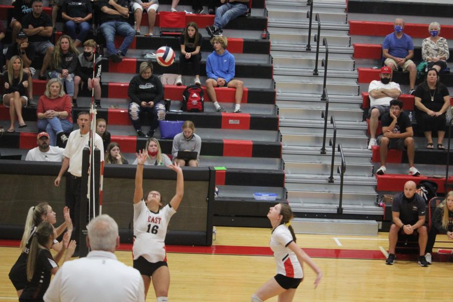 Senior Emily Huntsman sets up sophomore  Kate Cissell to attack the ball against Bullitt Central. "The camaraderie between my teammates and I was something that I've never felt before. They made me feel like I didn't have to be afraid to make mistakes," Cissell said.   