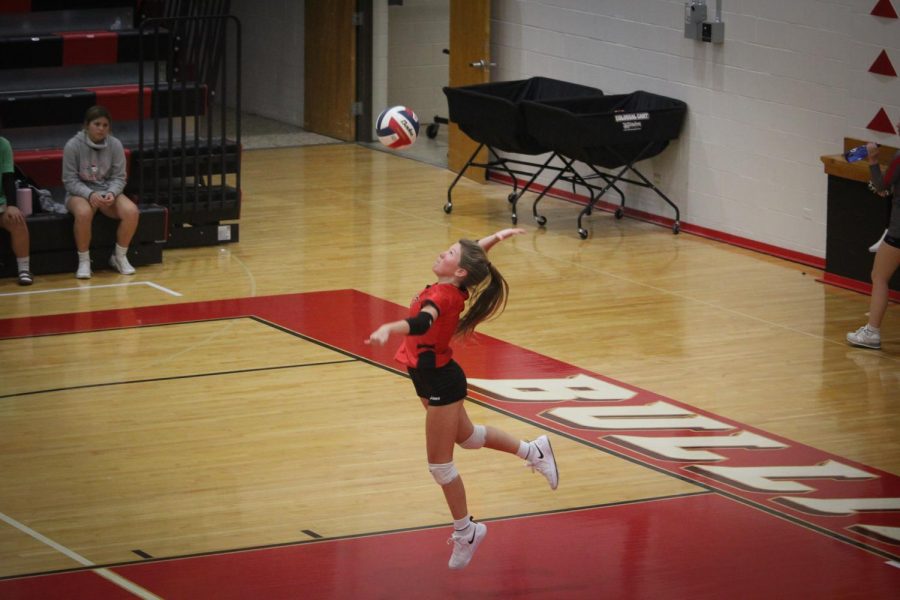 Junior Torrie Frist serves the ball in the second set against Bullitt Central. "When I play volleyball it's the best feeling ever. I have been playing for about 11 years now and everytime I step on the court I still get excited to play," Frist said.
