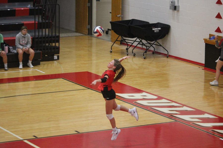 Junior Torrie Frist serves the ball in the second set against Bullitt Central. "When I play volleyball it's the best feeling ever. I have been playing for about 11 years now and everytime I step on the court I still get excited to play," Frist said.
