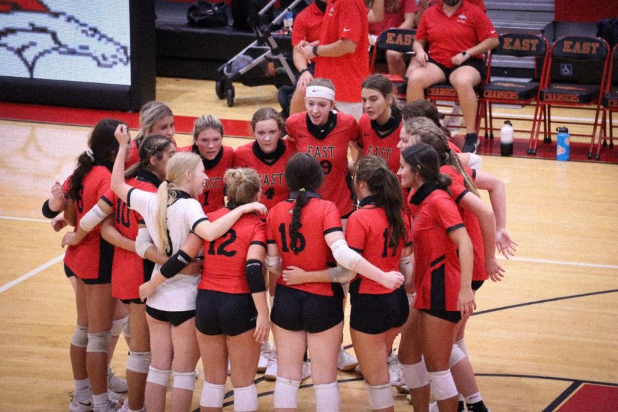 The Lady Chargers in a team huddle before they start their game. They played against Kentucky Country Day Sept. 2 and won 3-0. “The bond our team had was so great, everyone was close and it made playing with each other so much better,” junior Torrie Frist said. 
