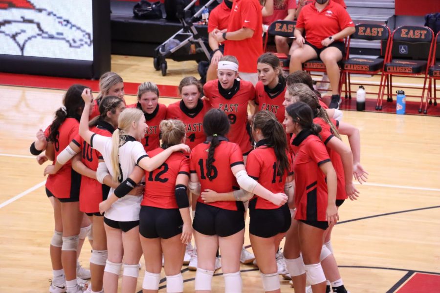 The Lady Chargers in a team huddle before they start their game. They played against Kentucky Country Day Sept. 2 and won 3-0. The bond our team had was so great everyone was close and it made playing with each other so much better, Junior Torrie Frist said. 