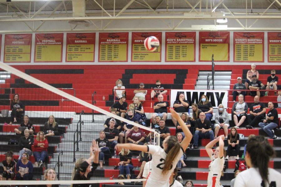 Junior Emma Brogan prepares to attack the ball after it's over the net. 