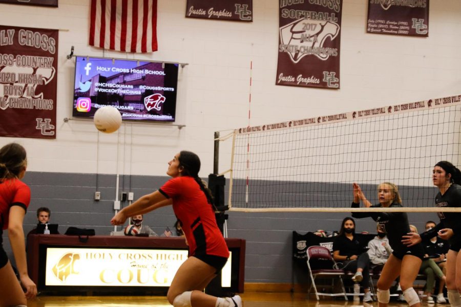 Senior Emily Huntsman adjusts as the ball gets behind her and passes the ball to attackers.