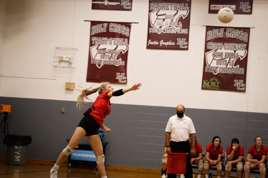 Junior Torrie Frist serves the ball in the first round of regions. When we played Holy Cross we played our hardest but couldnt pull through. We were all sad that our season had come to an end because our team is a second family to all of us, Frist said.