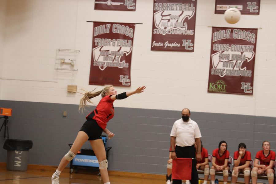 Junior Torrie Frist serves the ball in the first round of regions. When we played Holy Cross we played our hardest but couldnt pull through. We were all sad that our season had come to an end because our team is a a second family to all of us, Frist said.