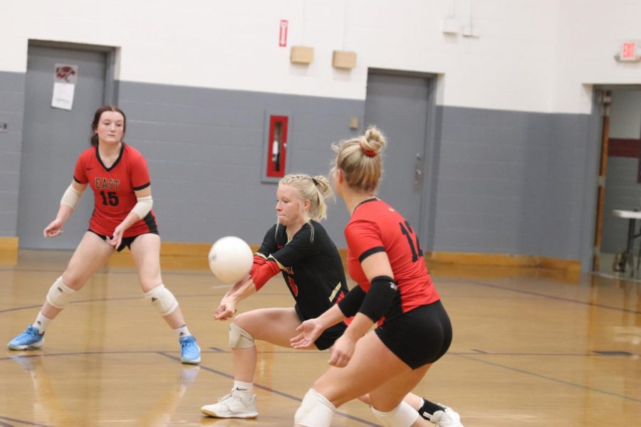 Senior McKenna Humphrey reaches for the ball after Holy Cross deep serves. We played with everything we had and put our all into the game, Humphrey said. 