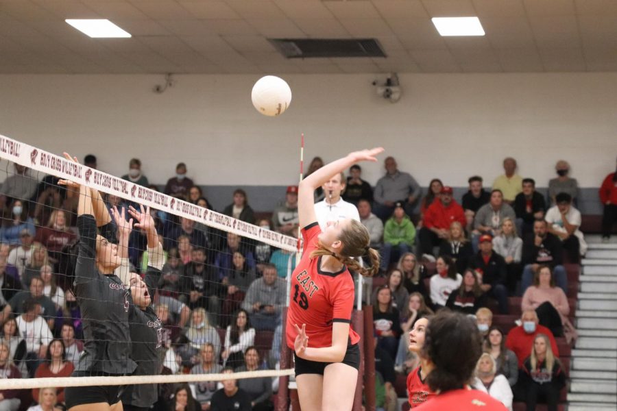 Sophomore Kate Cissell uses her height to jump up above the net and attack the ball. "Being able to attack the ball and get a flashy hit is great and all but I could literally never do it without the passers and setters," Cissell said.