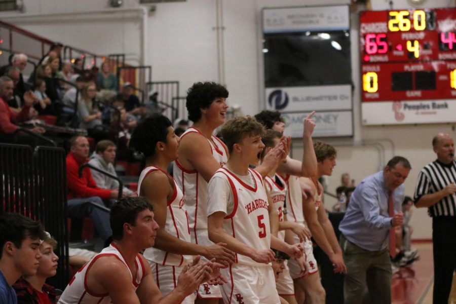 The team celebrates as they are about to win the game against Breckinridge County. “It felt great winning big and being able to get some of our younger guys in the game,” senior Tucker Blanford said. 