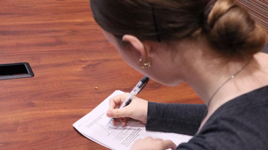 With her midterm coming up soon, senior Molly Phelps works hard to study for her math test. Phelps has always worked hard to get her good grades and hopes others will as well. "Seriously don't put off what you need to know for your tests, make sure it is fresh in your mind," Phelps said.