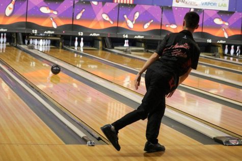 Senior Austin Hale bowling one of his strikes from the game against Pleasure Ridge Park High School. Jan. 11, Hale along with his teammates played against PRP, and lost. “Today, I feel we did the best that we could. PRP is a hard team to beat. Theres a lot of ins and outs in the bowling world, and even that PRP couldnt really figure it out. So, it was rough for everybody, but overall, we did pretty good. Everybody did their part,” Hale said, “Some highlights for me would be my first four strikes in the second game, which was pretty good. I should have gotten that fifth, but stuff happens. Beggars cant be choosers. Highlight for the team. We only lost the first bakers game by 40 pins. So, I mean, were right on their toes as soon as we get more consistency out of our players, we will probably be a pretty good matchup for PRP.”