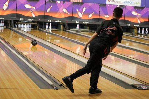 Senior Austin Hale bowling one of his strikes from the game against Pleasure Ridge Park High School. Jan. 11, Hale along with his teammates played against PRP, and lost. “Today, I feel we did the best that we could. PRP is a hard team to beat. There's a lot of ins and outs in the bowling world, and even that PRP couldn't really figure it out. So, it was rough for everybody, but overall, we did pretty good. Everybody did their part,” Hale said, “Some highlights for me would be my first four strikes in the second game, which was pretty good. I should have gotten that fifth, but stuff happens. Beggars can't be choosers. Highlight for the team. We only lost the first baker's game by 40 pins. So, I mean, we're right on their toes as soon as we get more consistency out of our players, we will probably be a pretty good matchup for PRP.”
