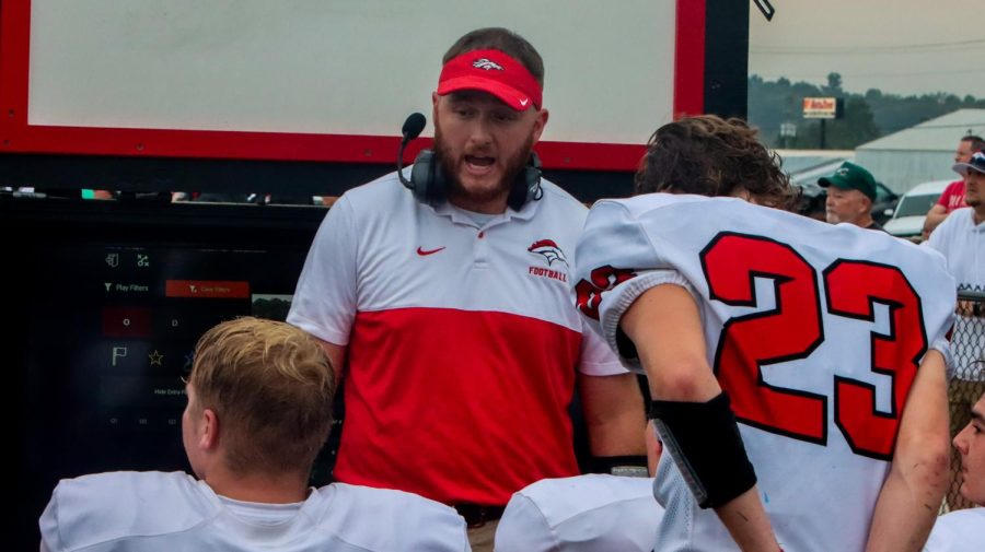 Head Football Coach Keegan Kendrick from the previous season talking to players. Jan. 18, Kendrick was named the new head coach by the athletics department of Bullitt East High School. “For myself, I want to be the model that these kids need to have. The expectations I have for myself are to work hard every single day, communicate to my guys our standard and what our expectations for this program are to be, and to hold them and our coaches to that standard, and make sure everyone is going on the right course,” Kendrick said.