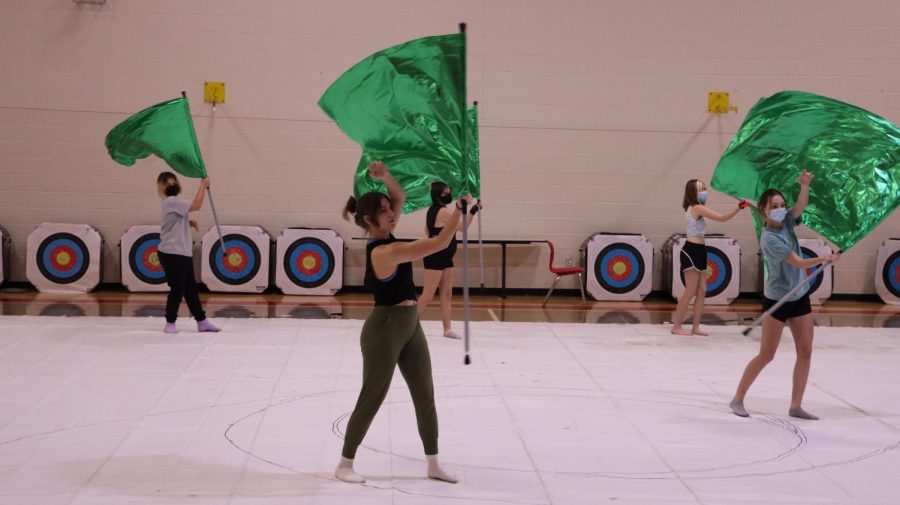 The team practices their latest work to prepare for their first show. The team has prepared with multiple practices earlier in the season to improve their work. "We really just want to make sure we get our work perfect before we perform," junior winterguard member Skylar Braden said. 