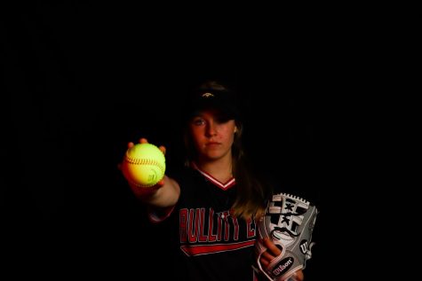 Junior Kimberly Perkins holding softball out in front of her. Perkins believes that the team will go far this year. "With a new coach, I think we are finally starting to come together, especially since last season. We made it to the regional championship. So, I think this year, we're heading for state," Perkins said.