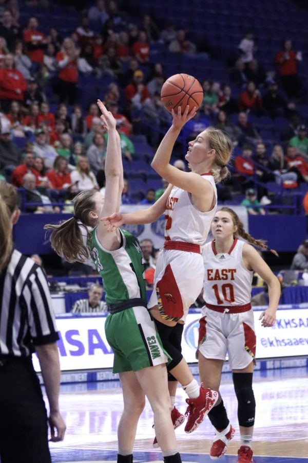 Lilly Reid leaps into the air for a layup. On March 11 the lady chargers played at Rupp Arena in the KHSAA state tournament against Meade County. "It's every high school player's dream to get to the state tournament," Reid said. 