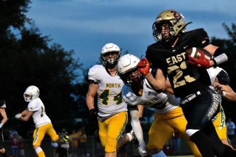 Senior running back Mason Gauthier carries the ball down the field while being chased by three North Bullitt players. 