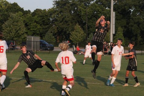 Ethan Davis jumps up to get a header on the ball. Last week the Boys Soccer Team played Fern Creek. "I think we're good we just need to get better with a few little things," Gabe Brangers said. 