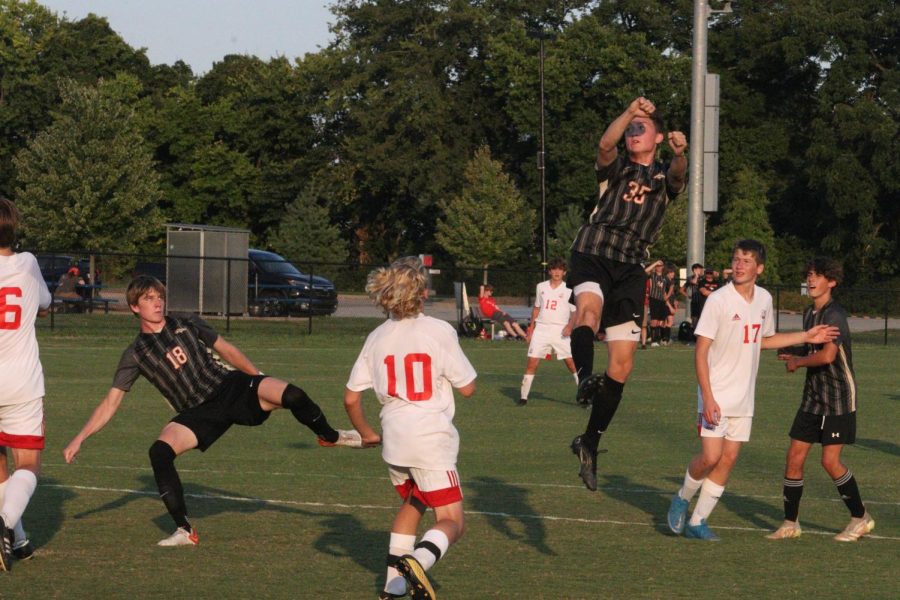 Ethan Davis jumps up to get a header on the ball. Last week the Boys Soccer Team played Fern Creek. "I think we're good we just need to get better with a few little things," Gabe Brangers said. 