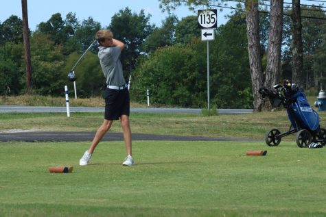 Freshman Aidan Boyer tees off on the par four number one at Elizabethtown Country Club.