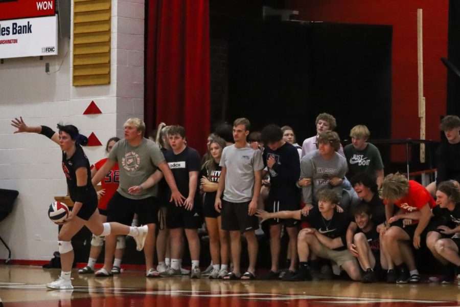 Tense crowd at the North Bullitt game. Cara-Lynn McCord is serving the ball. We really wanted to win against North Bullitt, senior Torrie Frist said.