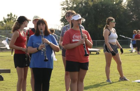 The marching band members prepare for their next competition. The band practiced throughout the week for the next performance. "I think we can do a lot better than we're doing right now," senior colorgaurd member Skylar Braden said. 