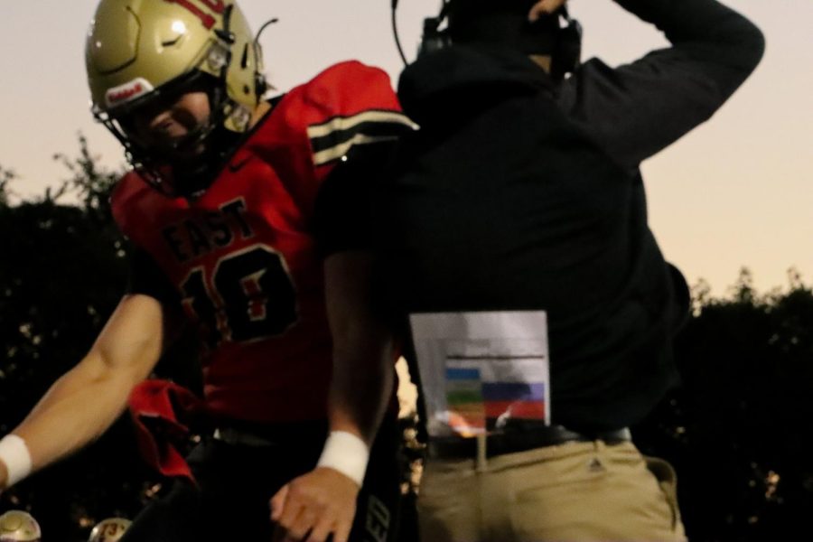 Senior quarterback Travis Egan celebrates after a touchdown in the first half against Danville.