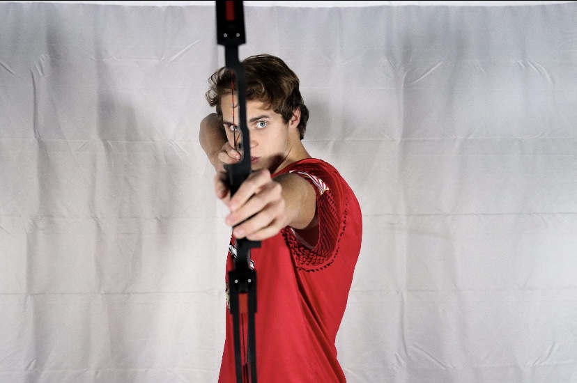 Senior Evan Sexton aims his bow. The archery team has prepared to have a good season. "Focus is one of the biggest keys in archery and what I am really working to improve on," Sexton said. 