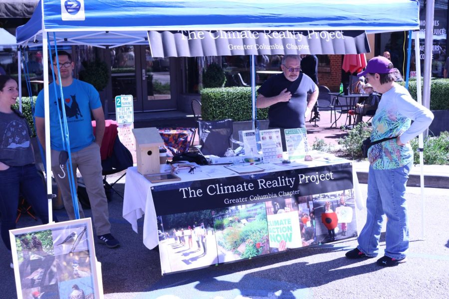 Columbia Audubon Society stands around their booth in the Columbia, South Carolina street market on March 4, 2023. The organization has used its social media to draw in new members in recent years. There are so many interesting species here that people don’t realize theyre here,” Columbia Audubon Society Member Allison Bugarin said.