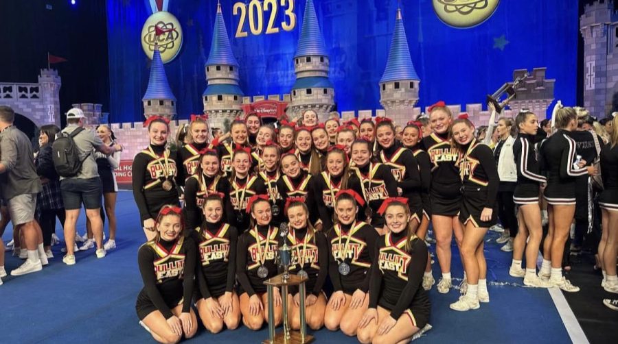 The cheer team poses with their recently won trophy. The team ended 2nd out of 56 teams in the Medium varsity D1 division. "Knowing the next season we have to take everything to the next level with perfecting our routine, and coming together as a team to achieve the end goal of bringing home a National title is the goal in mind," junior Kaylie Scott said.