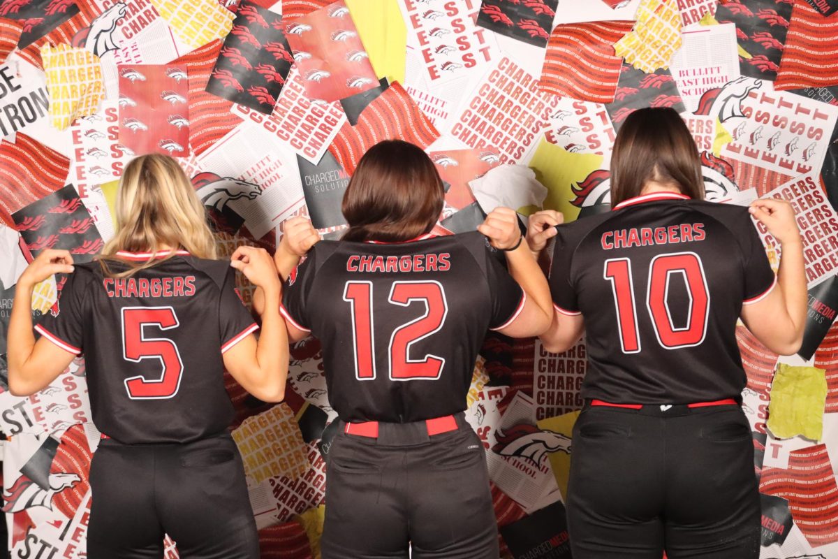 Girls Softball team members pose for media day with a busy season ahead of them.