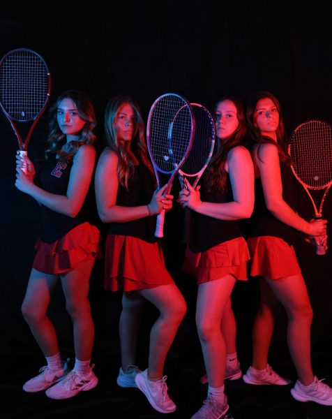 Girls Tennis poses at media night, ready to take action this season.
