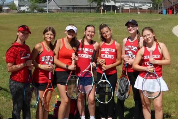 The girls tennis team poses before their matches against Mercy.