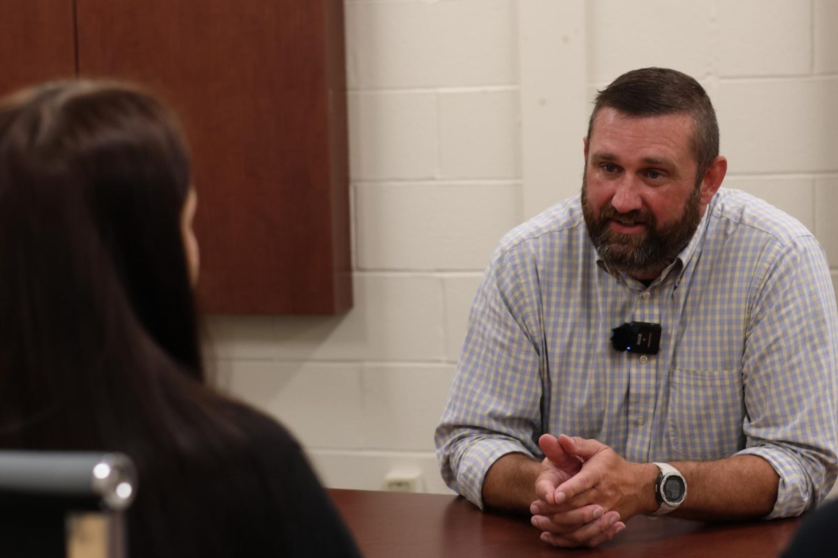 New Principal Josh Lightle answers a question from yearbook editor-in-chief Bailey Basham. 