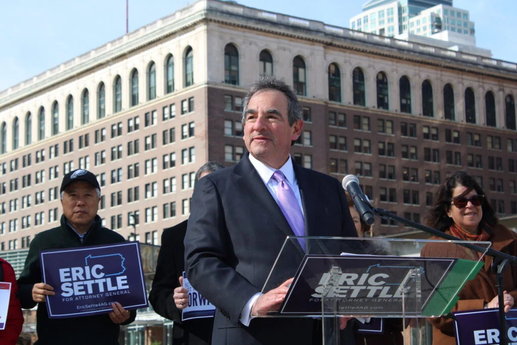 Eric Settle (left) joined former New Jersey Gov. Christine Todd Whitman (right) at a press conference in Philadelphia on March 26, 2024, where he signed a pledge to run for Pennsylvania attorney general as a Forward Party candidate.